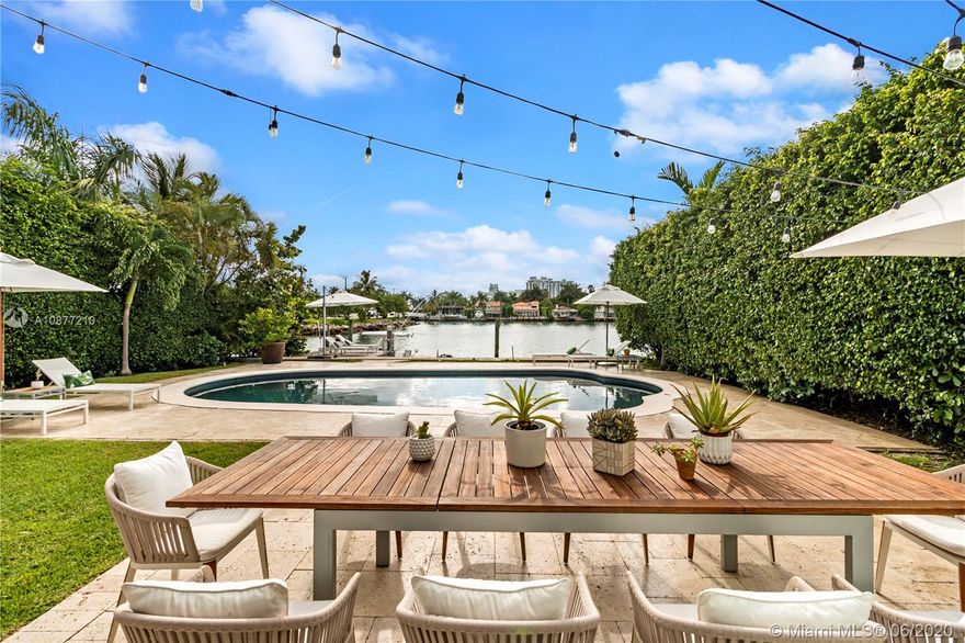 Breakfasts by the pool and moonlit dinners overlooking Biscayne Bay await at this curvaceous 4BED/3 1/2 BATH 1940s Art Deco renovated Venetian Islands waterfront home with its own boat dock. Marble kitchen counters & floors, stainless steel appliances, wood floors, updated bathrooms and hurricane impact glass throughout. Discover the serenity of Di Lido Island, a quiet refuge linked to the buzz of South Beach by the scenic Venetian Causeway, the preferred route for walkers, runners, skaters & cyclists. Enjoy dramatic views of the Miami skyline from an expansive top deck off the master bedroom. 421 E Di Lido is the most romantic home in the Venetians and the best move-in ready deal available on the water! We can't wait to preview it with you. Let us know if you'll be arriving by boat!!