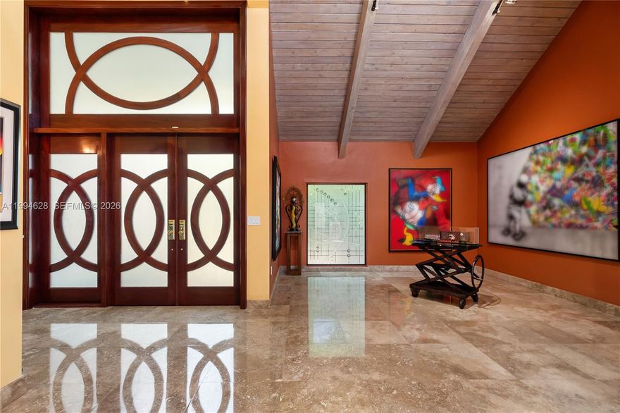 Stunning entry with large mahogany double doors and high ceiling foyer entry. This 5 bedrooms with 5 full and 2 half baths home features a true chefs kitchen by Mia Cucina featuring lighted glass and wood cabinetry, dual sinks, two dishwashers, SubZero refrigerator, Viking gas oven, Miele double oven and an array of extras for the chef in the family. The formal dining room has recessed lighting with wood beam accents. The eat-in kitchen has a view of the courtyard. And, adjacent to the kitchen is a temperature controlled wine cellar holds up to 1900 bottles. The center courtyard is accessible from a variety of different living areas which brings in a lot of natural light throughout. A major highlight is a custom built separate bar room nestled at the end of the courtyard. The courtyard gives entry to a private gate which allows access to the common areas which creates a large backyard feel.The first floor has a possible maids quarters with full bath. Also, a large den that can be used as a  media room. Skylights and mahogany doors are found throughout the house. Space for a private elevator. Upstairs you will find a large master bedroom with a separate sitting area and private sauna. The office and gym can be converted to a large bedroom. The junior suite  has walk in closet with a large bathroom. The private community has a heated pool, tennis courts, pickleball courts, a dog park, security gate, a community center, a park, basketball, and soccer.