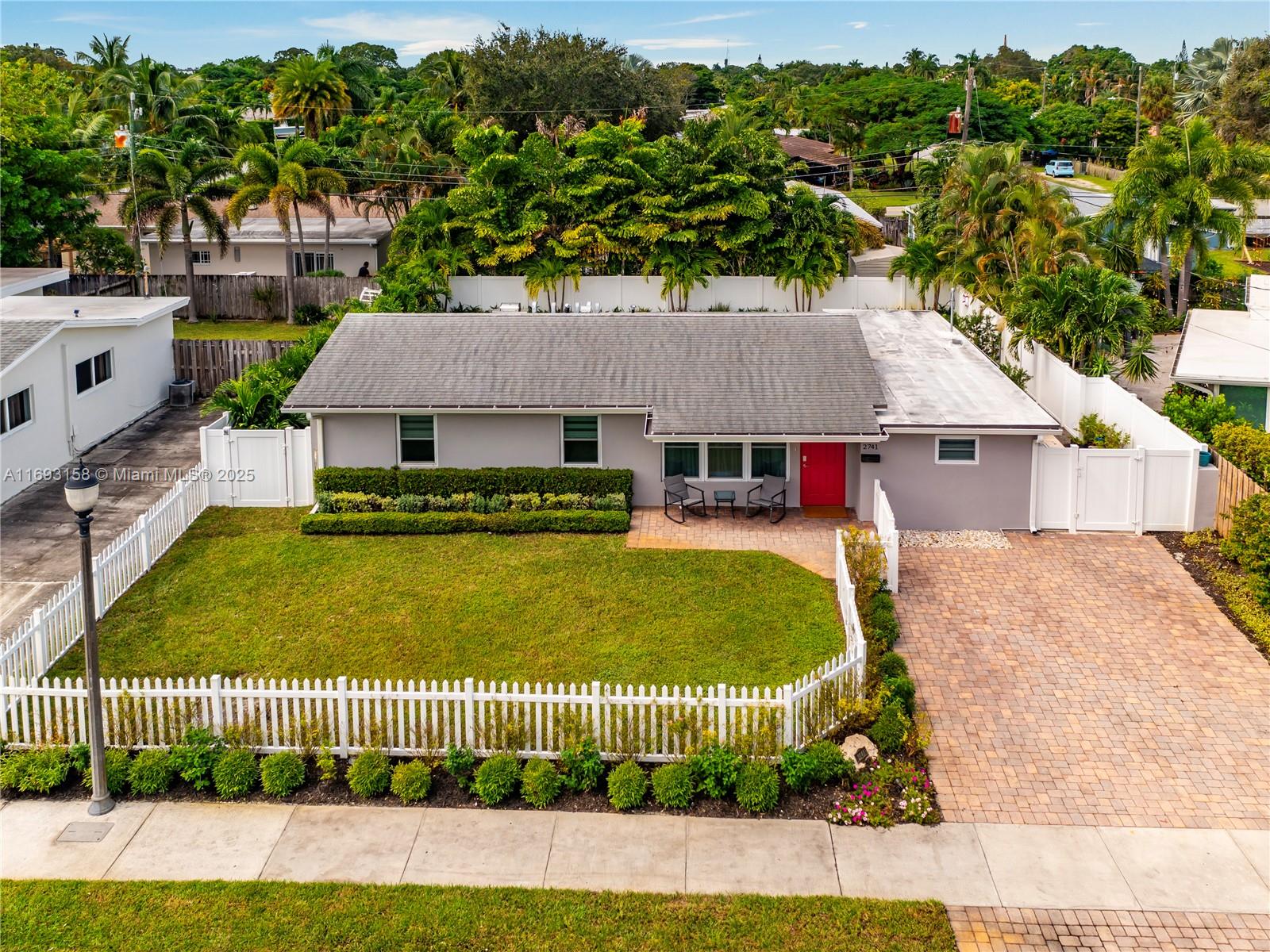Discover luxury & comfort in this fully furnished, turnkey 4-bedroom, 4-bathroom home near Wilton Drive. Extensively remodeled, this stunning property features all-new electrical, plumbing, floors, walls, bathrooms, interior & exterior lighting, modern kitchen, appliances, resurfaced pool, deck, air conditioning, paint throughout and adding a cabana bath. Every detail was considered to create the perfect home for entertaining and hosting large groups. With two primary bedrooms with en suite bathrooms, there is the potential to create a standalone 1/1 unit complete with a living area. This home is perfect for immediate move-in or as a ready-to-rent investment. Enjoy easy access to vibrant local amenities and a stylish, upgraded living space that’s designed for convenience and relaxation.