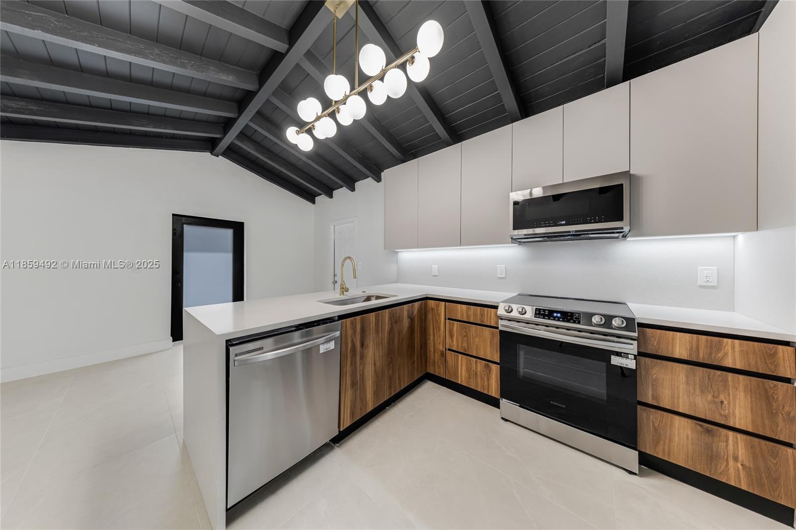 Fully Remodeled and Move-In Ready! This stunning 3-bedroom, 2-bathroom home has been thoughtfully upgraded with state-of-the-art features and luxurious finishes. Inside, you'll find a modern chef's kitchen with quartz countertops, high-end appliances, and custom cabinetry. The interior boasts porcelain tile flooring, impact-resistant windows and doors, and beautifully designed bathrooms with exquisite details. The spacious master suite includes a custom walk-in closet, and the home is equipped with a full washer and dryer for added convenience. Situated in the most ideal location close to Downtown, Wynwood, the airport, and much more! This home is the perfect blend of style, comfort, and functionality! IDEAL AND CENTERED LOCATION!!