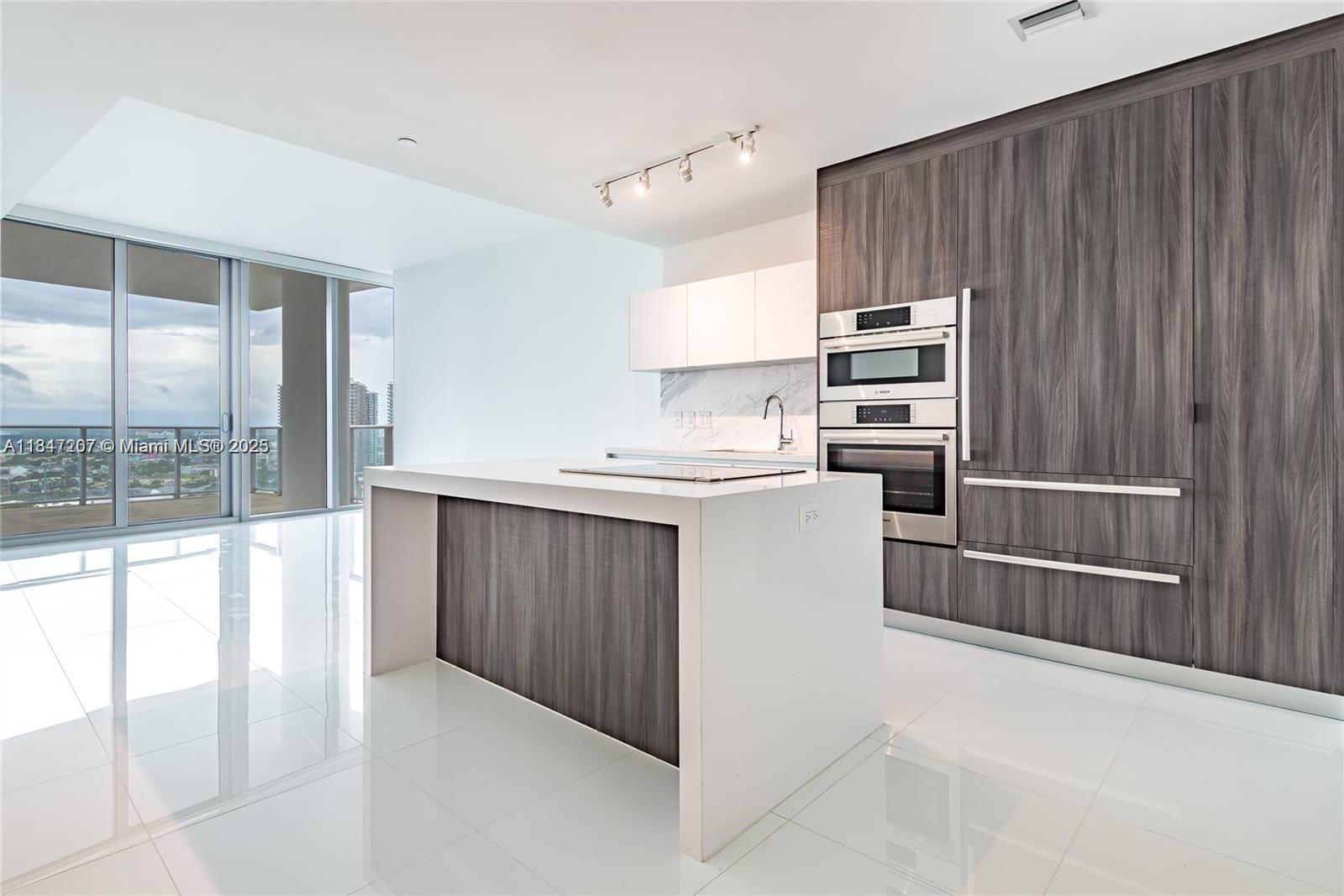 Stylish 1-bedroom, 2-bath condo located in the heart of Downtown at Miami Worldcenter, one of the most amenity-rich buildings in the world. Enjoy five resort-style pools, full-service spa, outdoor lounges, summer kitchens, basketball and racquetball courts, yoga and boxing studios, a music lounge with jam room and recording studio, and much more. The unit features a private elevator entry, sunset-facing balcony, Bosch and Sub-Zero appliances, one assigned parking spot, plus complimentary valet for residents. Walk to Bayside, Kaseya Center, Metro Mover, and Brightline, with Brickell, Wynwood, South Beach, and the airport just a short drive away.
