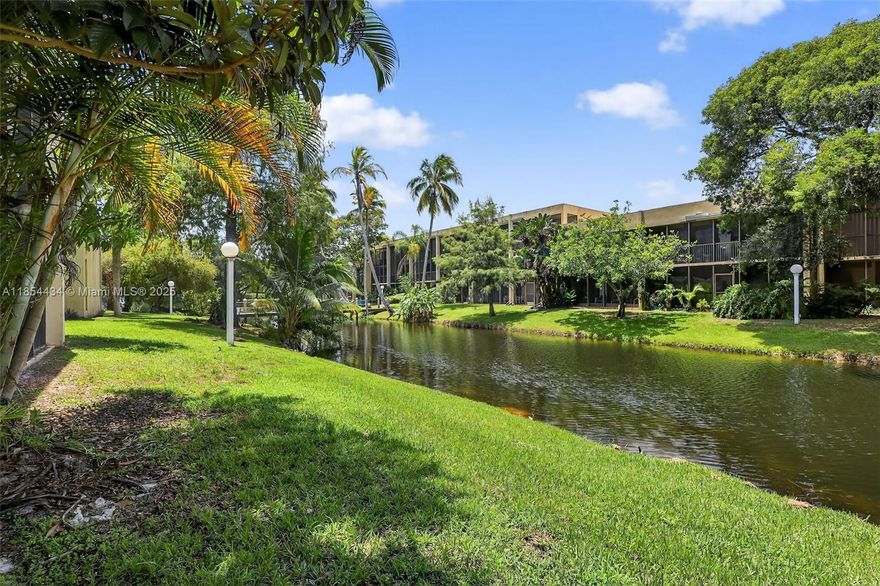 Beautifully updated 2/2 ground-floor condo in the heart of Davie! Enjoy stunning lake and pool views from the long screened patio—perfect for relaxing mornings or after a long day. The primary bedroom also overlooks the lake & has direct patio access, creating a peaceful retreat. Features include 2025 washer, 2020 dryer & A/C, freshly painted kitchen cabinets, all new appliances (2022), modern lighting, and smooth ceilings (no popcorn). Both bathrooms have been updates. Bedrooms offer walk-in closets with custom systems. Two-entrance layout is perfect for a roommate setup or extra privacy. Assigned parking #89. Investor-friendly—NO Rental restrictions!!! Conveniently located near highways, universities, shopping, restaurants & airport. Schedule your showing today!