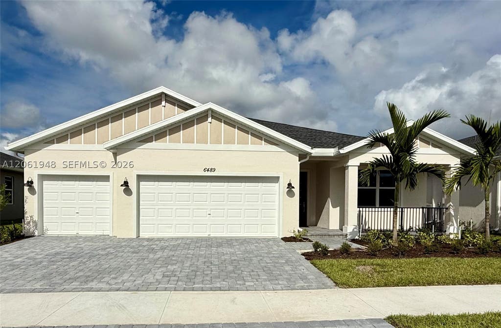 Photo of 6489 NW Cloverdale Ave, Port St Lucie, FL 34987 (MLS # A12061948)
