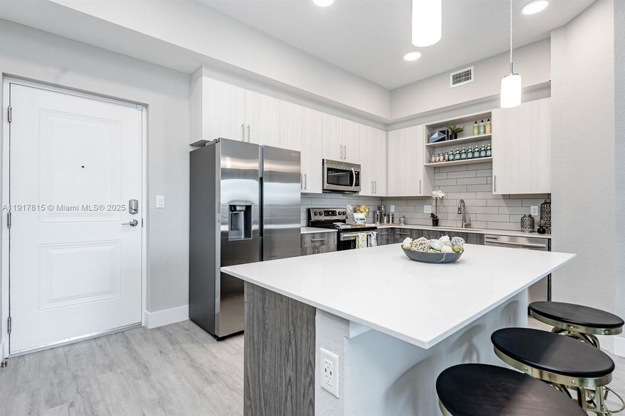 Discover effortless living in this stunning top-floor corner apartment, where every detail has been tailored for comfort and style. The spacious Brighton floor plan boasts 1,208 sq ft that houses two large bedrooms and two well-appointed bathrooms. The 11-foot vaulted ceilings amplify the sense of space, and large windows invite an abundance of natural sunlight in. Enjoy a modern kitchen featuring sleek Samsung stainless steel appliances and contemporary finishes. Nestled within the vibrant community of Tamarac Village, which spans over 12 pet friendly manicured acres, residents can indulge in exclusive amenities including a grand two-story clubhouse, a refreshing pool, and controlled access parking.  Close to major roads, parks and great shopping and dining.  Schedule your tour today!