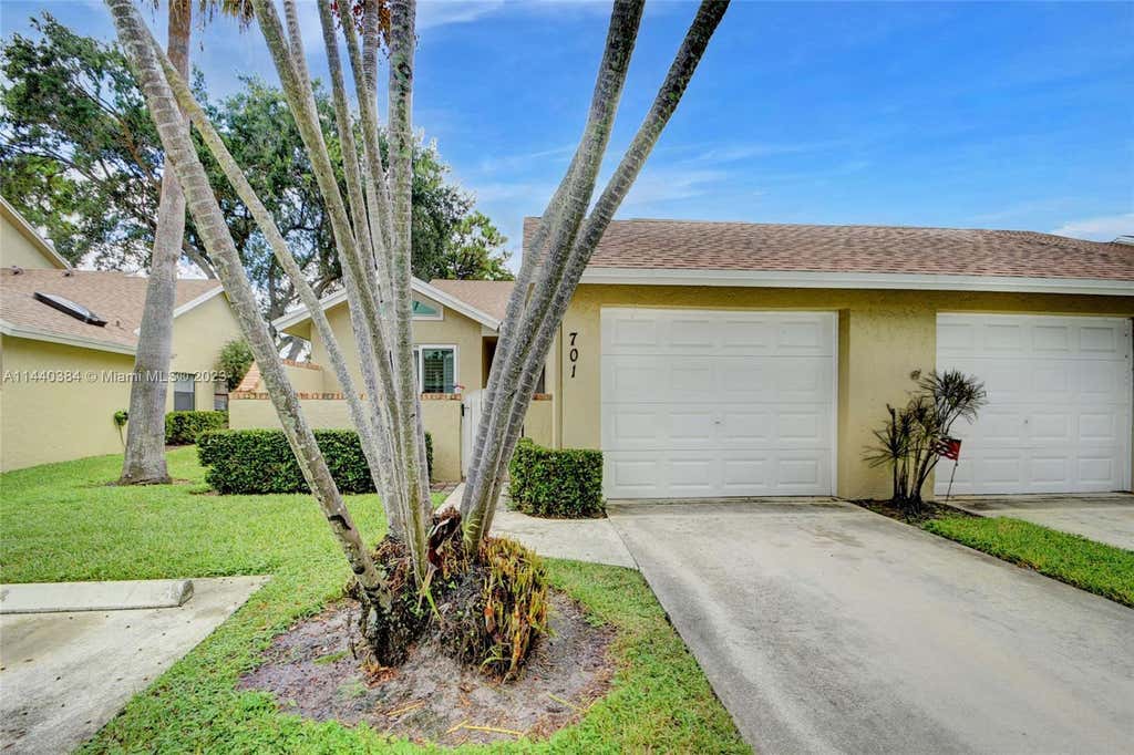 Photo of 701 Maplewood Dr, Green Acres, FL 33415 (MLS # A11440384)