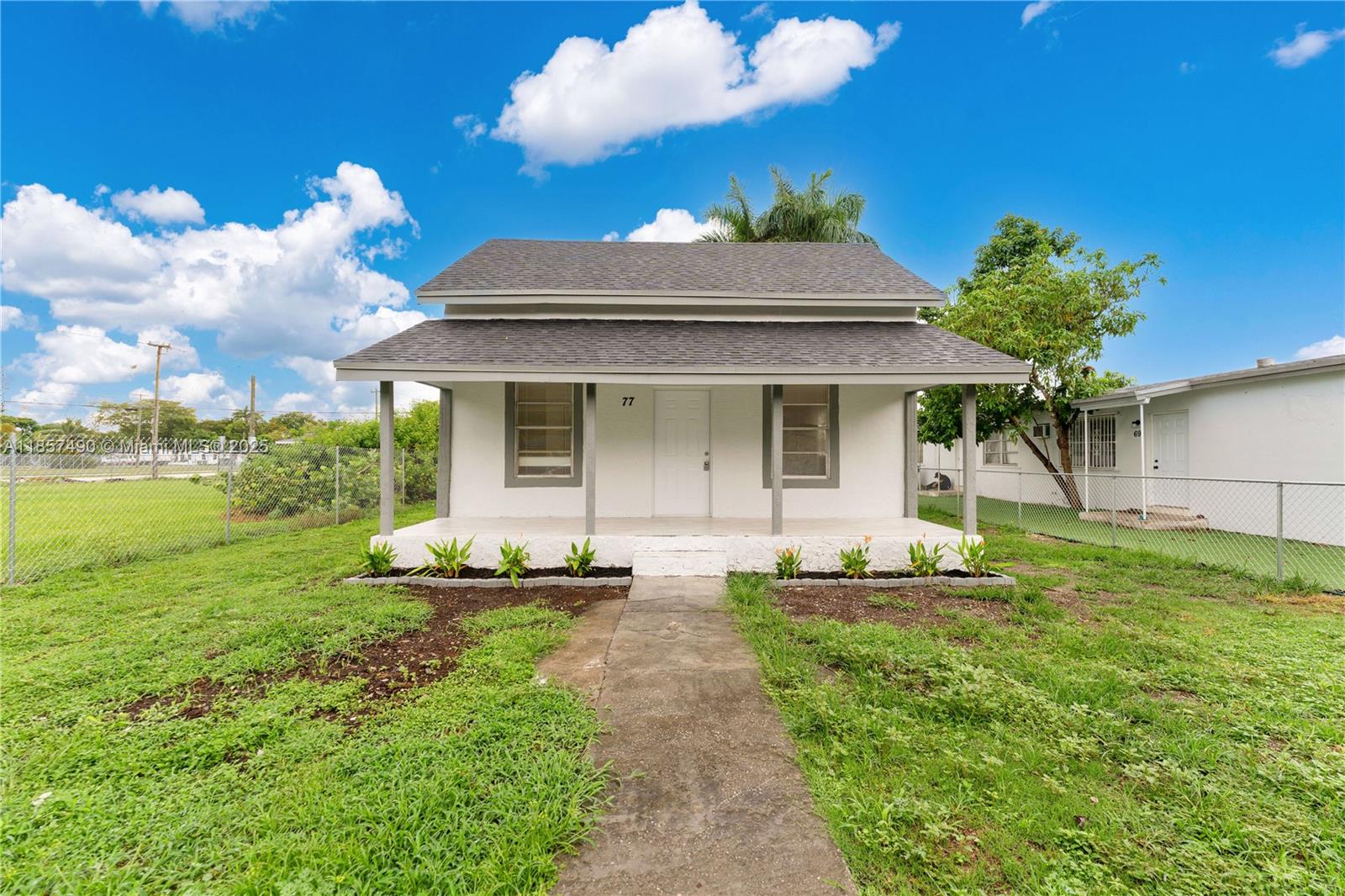 Charming two-story cash flowing triplex gem in the heart of Homestead. 2 buildings, 1 with a 3/1 and 2 with 2, 2/1 This property offers 2 bed 1 bath per unit and sits on a 6,500 sq ft lot. Back street makes easy access for back units. Constructed of durable concrete block with above-average quality. It has been updated with beautiful countertops, stainless steel appliances, and bathroom fixtures. This property blends solid build and proximity to great schools, major highways, and amenities — ready for investors or as a live-work opportunity. Tenants have been there for a long time.