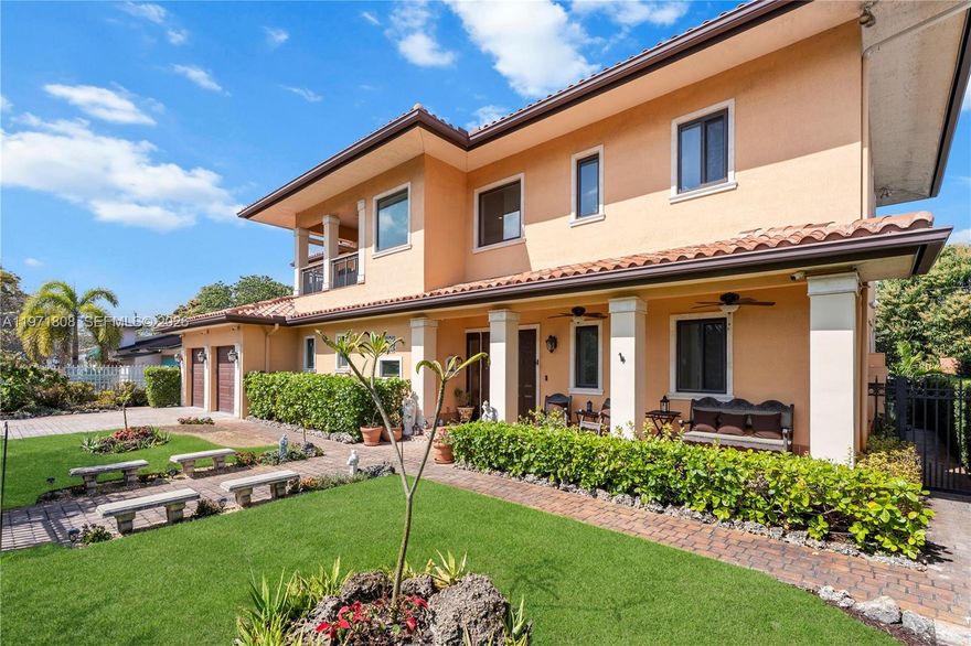 Mediterranean-inspired residence built in 2017 with a focus on enduring quality and craftsmanship. Constructed of solid concrete block with a concrete roof and classic Spanish “S” tile, the home reflects structural integrity and timeless architectural design. The interior showcases exceptional custom woodwork, substantial millwork details, and rich finishes throughout. A chef’s kitchen anchors the home with floor-to-ceiling custom cabinetry, stone countertops, an oversized walk-in pantry, and generous workspace designed for both everyday living and entertaining. Offering four bedrooms, including a primary suite on the ground level with an ensuite bathroom and walk-in closet, the layout provides flexibility and comfort. An additional primary suite upstairs enhances functionality. Bathrooms are well-appointed with quality finishes. Custom flooring extends throughout the residence, complementing the home’s architectural character. Impact-rated doors and windows, a gas-powered Generac generator with underground tank, closed-end foam insulation, and a cistern system contribute to the property’s infrastructure. Outdoor spaces include covered terraces, manicured landscaping, jacuzzi, and a rear patio. Centrally located minutes from Coral Gables, Miracle Mile, Brickell, and Downtown Miami.