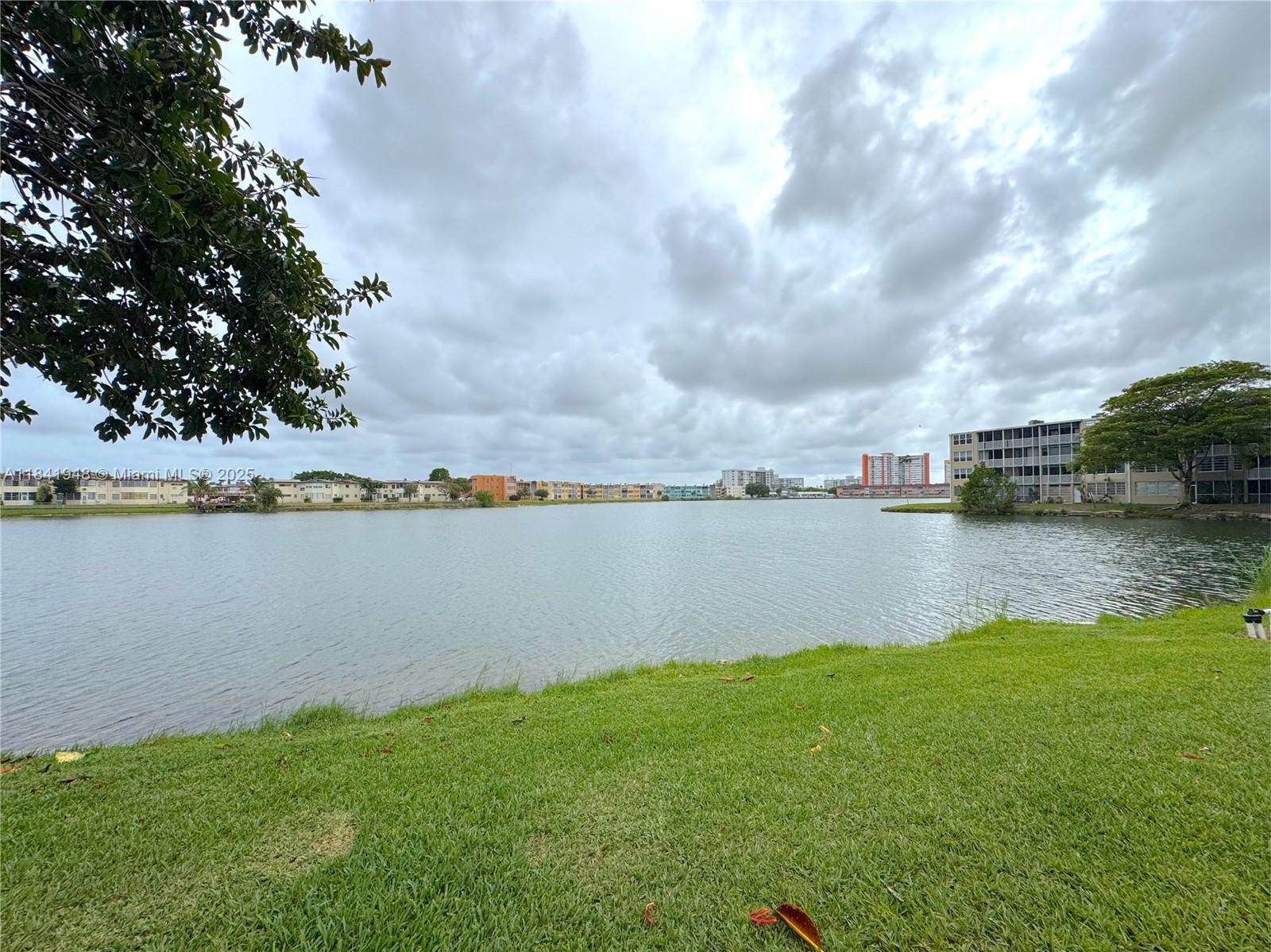 Spacious and oversized 1-bedroom, 1.5-bath, with den unit located on the second floor featuring unobstructed lake views in a gated community with security patrol. This well-located property includes an additional same floor storage unit and is currently tenant-occupied, making it an excellent investment opportunity with income from day one. Enjoy serene lakefront living just minutes from top-rated schools, shopping centers, Aventura Mall, and Sky Lake Mall. Walking distance to synagogues and places of worship. Property can be purchased for primary residence or continued as a rental. Tenant is paying $2,000 month. Sold As-Is. Unit can be accessed via elevator or stairs.