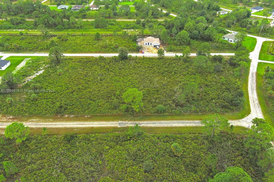 Exclusively listed by Sunland Real Estate: This prime 0.25-acre residential lot on the east side of Lehigh Acres is ready for development. With no neighboring properties and located in a high and dry area outside any flood zone, this lot offers the perfect opportunity for a peaceful and secure build.