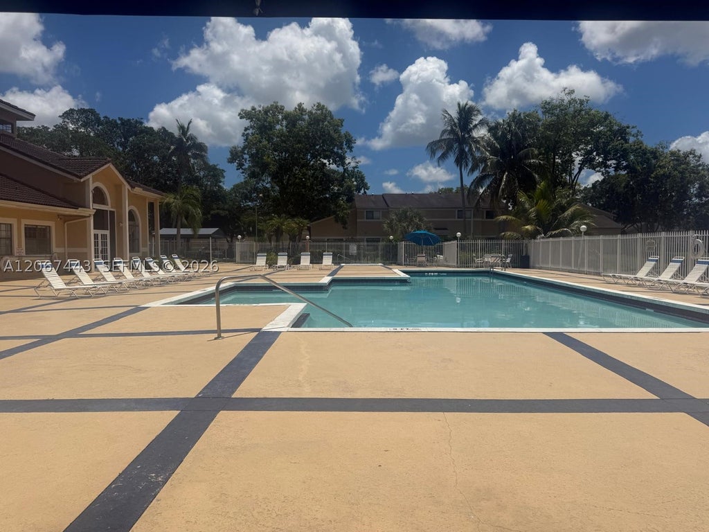 Photo of 203 E Palm Cir E, Pembroke Pines, FL 33025 (MLS # A12067443)