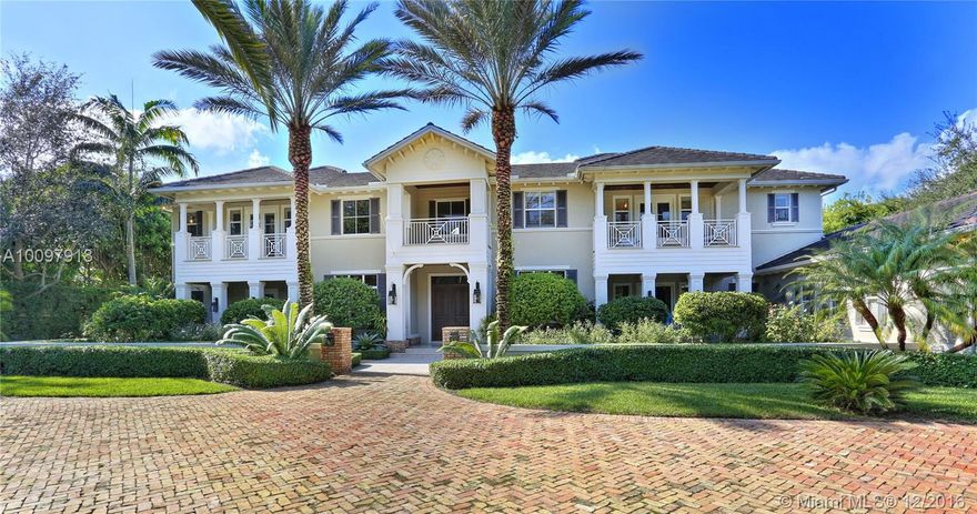 Grand and gorgeous timeless plantation estate in heart of Pinecrest. "2006" gem polished to perfection! Soaring volume ceilings, grand salon with fireplace. Gracious dining room, gourmet dream kitchen. Fabulous floor plan with downstairs lavish master suite! 2nd floor junior suite. Library, media/playroom, elevator. Showcasing finest taste and finishes. Marble and wood floors. Splendid in everyway! Inviting cascading pool. Summer kitchen, additional gazebo with fire pit, generator. Lush grounds and much more. Truly magnificent!