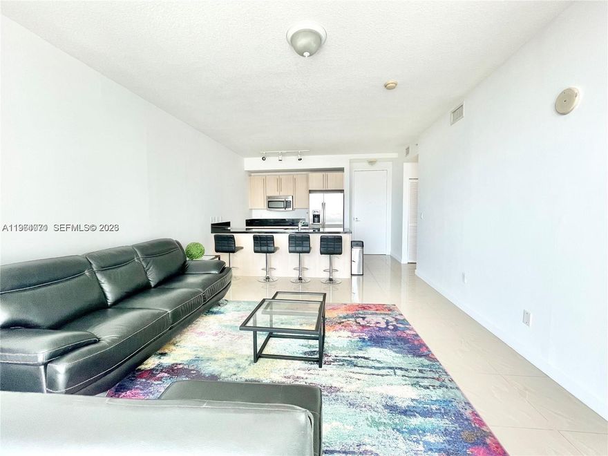 Direct bay, city and Brickell skyline views from the best line in the building. 1BD/1BA featuring porcelain floors, floor-to-ceiling windows, contemporary kitchen with stainless steel appliances and granite countertops, spacious bath with separate tub and shower, in-unit washer/dryer, and 1 assigned parking space. Full-service amenities include 2 pools, jacuzzi, BBQ area, media room, business center, state-of-the-art gym, steam room, and 24-hour valet and concierge. Prime Brickell location within walking distance to Mary Brickell Village, Brickell City Centre, Metrorail and Metromover.