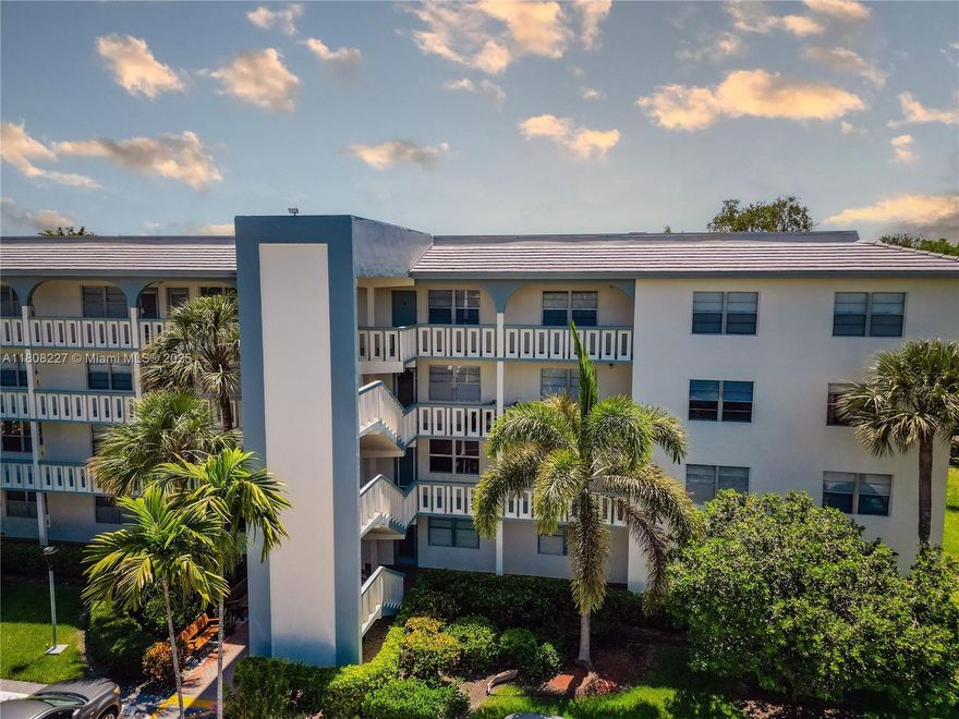 Motivated Seller! Lowest-priced corner unit available—extra space + oversized storage closet! Beautifully updated 2BD/2BA with 1,291 sq ft. Features include new A/C, new water heater, updated kitchen with full appliances & pantry, volume ceilings, split-bedroom layout, and spacious primary suite with walk-in closet & ensuite bath. Enjoy garden & pool views from your private screened balcony. Located on the 3rd floor of a secure building with top-tier amenities: heated pool, spa, tennis, golf, clubhouse, gym, courtesy bus & more. Assigned parking + large storage unit. HOA includes water, trash, landscaping & building maintenance. Move-in ready!