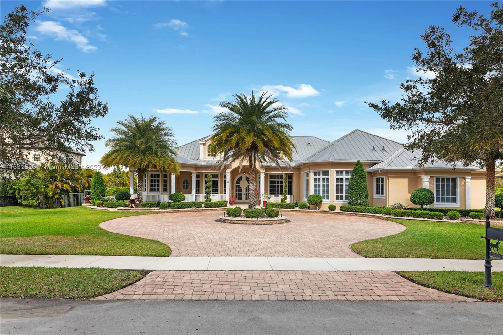 WELCOME TO CAMELOT ESTATES IN DAVIE FLORIDA! THE ULTRA PRIVATE BOUTIQUE NEIGHBORHOOD CONSISTS OF ONLY LARGE ESTATE HOMES WHICH ARE SITUATED ON A BUILDER'S ACRE LOT. THE ONE STORY HOME OFFERS A TRIPLE FLOOR PLAN FEATURING 5 BEDROOMS, 5.5 BATHS, MEDIA ROOM, OFFICE, GLAM ROOM, AND A STAND ALONE CABANA BATH IN ADDITION TO A 3-CAR GARAGE. THE 25' CEILINGS EMPHASIZE THE GRAND ENTRANCE, SETTING A STRONG PRESENCE THROUGH OUT YOUR LIVING SPACE. DUAL FIRE PLACES, A WELL APPOINTED GROUMET KITCHEN INCLUDING A BUTLER STATION, HURRICANE IMPACT WINDOWS, AND MUCH MORE CAN BE FOUND IN THIS IMPRESSIVE HOME. CAMELOT ESTATES IS MUNITES FROM THE EXPRESSWAY AND KNOWN FOR ITS EQUESTRIAN VIBE.