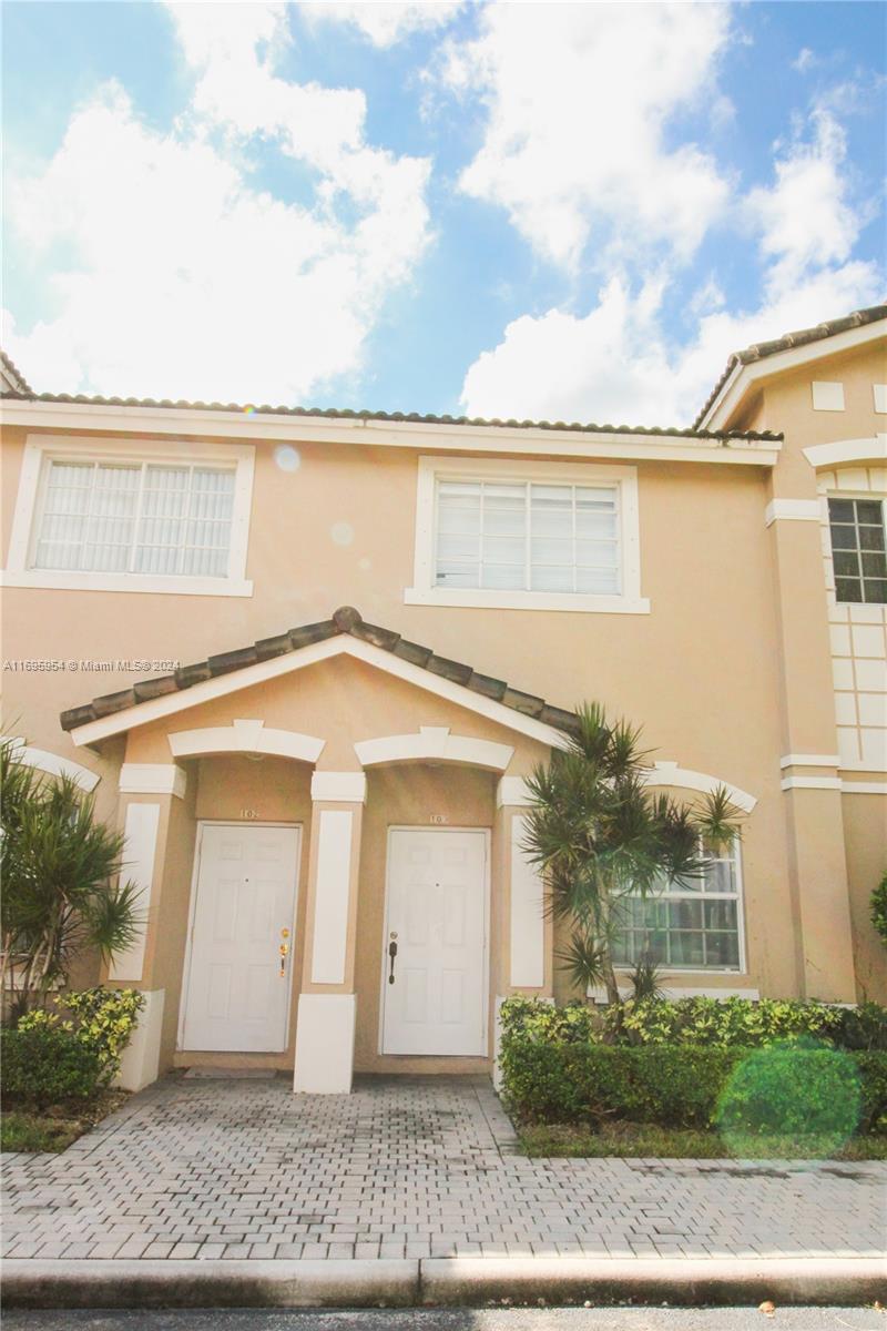 Beautiful 3/2.5 centrally located townhouse in Doral. The first floor features sleek tile flooring and an open-concept kitchen with white cabinets combined with a cozy family Room. Upstairs, and all bedrooms with vinyl on the floor, each with its own spacious walk-in closet and on-suite bathroom. The laundry area is conveniently located in front of the kitchen. Located just minutes from Turnpike exit for the North and South, Dolphin Mall, and local shops. Close to A ranked school. The property is also for rent. The property is fully PAID. The Association allows up to 2 vehicles. DON'T LOSE THIS OPPORTUNITY AT THE HEART OF DORAL!!