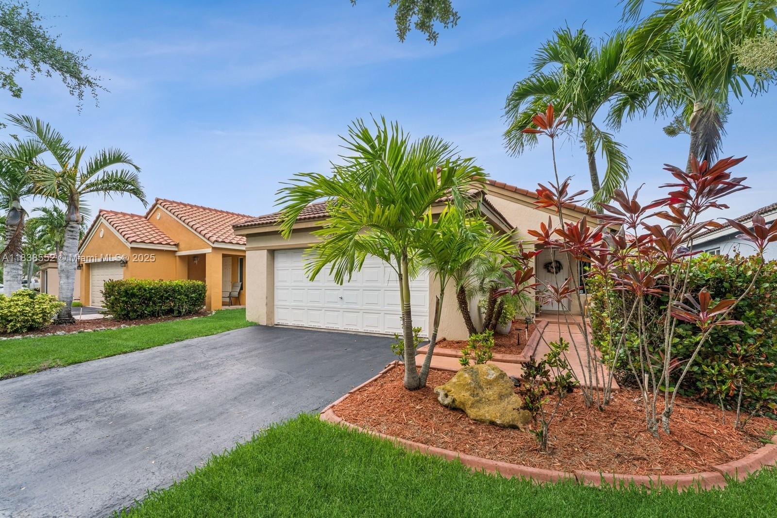 Say hello to this charming 3 bedroom, 2 bath home in the heart of Weston, FL! Nestled in a quiet, friendly neighborhood, this beautifully maintained single-family residence features a 2-car garage, elegant tile flooring, a sleek remodeled kitchen, and tastefully upgraded bathrooms. Relax or entertain in the screened-in patio, perfect for enjoying Florida’s sunshine year-round. Located just minutes from top-rated A+ schools, major airports, hospitals, lush parks, and more. Enjoy community amenities including a pool, playground, and scenic walking paths. School bus stop conveniently located inside the community.