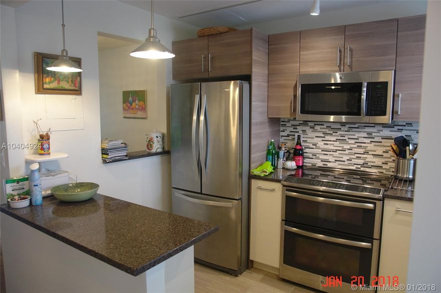 Bright and beautiful, this condo has exactly the right upgrades to make living easy:  An awesome kitchen, high end appliances, all ceramic floors, modern bathrooms and a screened patio for your morning coffee to tea.  This unit comes complete with danish style wood furniture.  exclusions include artwork, the pot hanger in the kitchen and personal items.  However, despite the exclusions, there are a lot of nice expensive items that stay.  WOW, this unit also includes an appliance maintenance contract which means free repairs on anything from the refrigerator to the A/C!  Don't be shy.  Take a look today before anyone else claims it!