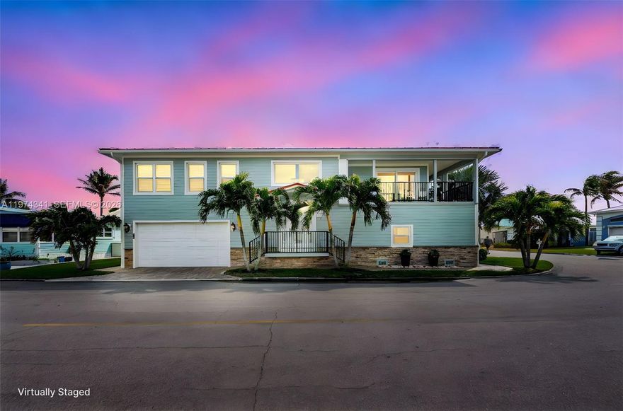 Discover coastal living in the highly desirable Venture Harbor community at 10751 S Ocean Dr, Unit B2. This elevated residence offers unobstructed water views without being directly on the water--enjoy scenic vistas and ocean breezes without dock or seawall maintenance. Featuring approx. 2,460 sq ft of living space, two ensuites and half a bath for guests, this corner home includes a drive-through garage with room for vehicles, golf carts, and storage, plus a PRIVATE ELEVATOR for easy access to open concept living space. The elevated design enhances privacy, airflow, and natural light. Venture Harbor offers a community marina, boat ramps, RV/boat storage, pool hall, pickleball, tennis, fitness center, recreation facilities, and private beach access. Age-qualified community: one resident must be 55+, all others 18+.