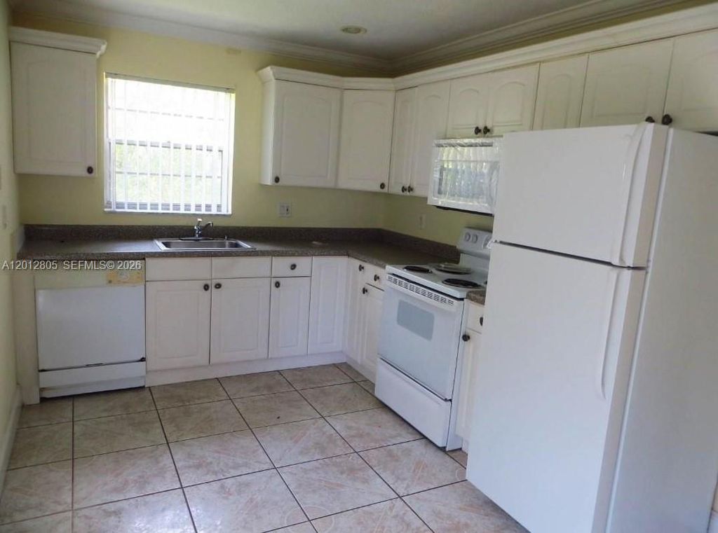 Photo of 3700 Riverside Dr #1, Coral Springs, FL 33065 (MLS # A12012805)