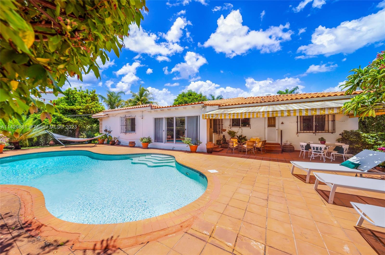 Unique opportunity to own a meticulously maintained 4 bedrooms plus living room pus dining room / 3 bathrooms pool home in the prestigious lower part of North Bay Road.
Gorgeous extensive outdoor area surrounded by rich tropical vegetation . This house sits on a oversized 11,200 sf lot offering many possibilities. Rebuild, expand or renovate . This property is surrounded by multi million dollars mansions in the most exclusive area of Miami Beach.