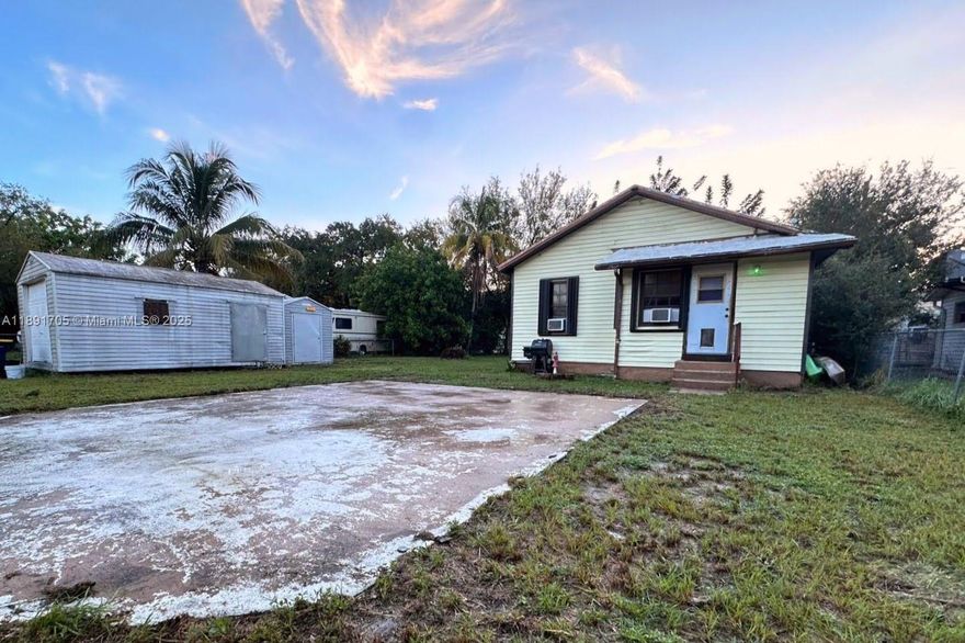 Charming 3BR/1BA single-family home on a spacious 9,659 sq ft lot in desirable Dania Beach. This home features a remodeled kitchen, bathroom, and laminate flooring—plus updated electrical and plumbing systems. Two outdoor sheds provide storage and a laundry area, and there’s parking in front and back with room for a boat or RV. The roof will need to be replaced; however, the seller is open to offering a credit or replacing it with the right offer, providing value and flexibility for buyers. Conveniently located near major highways, airport, the beach, and the Hard Rock offering dining, shopping, and entertainment. The neighborhood is transforming with new construction nearby, making this property ideal for first-time buyers, investors, seeking opportunity in a prime location.