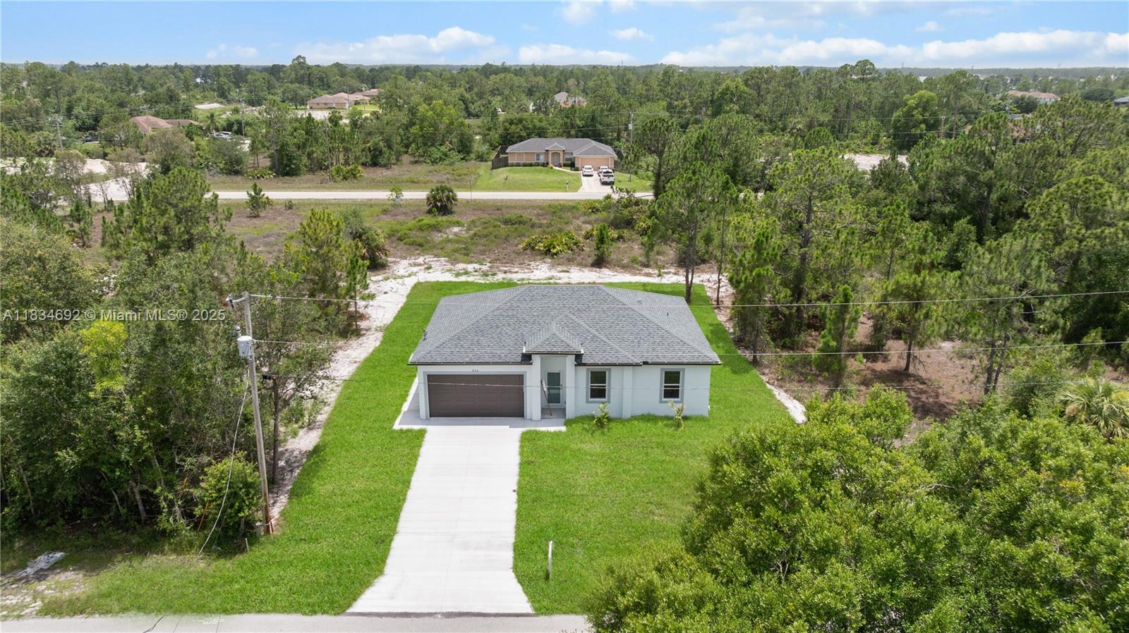 NEW CONSTRUCTION****Beautiful 3 bedrooms, 2 bathrooms, located in a fast growing area in Lehigh Acres. This home has an open floor plan, high ceilings, porcelain tile floors throughout the entire home, stainless steel appliances, impact windows and doors. Beautiful white cabinets and quartz counter tops. Schedule your showing today and come see this beautiful home!