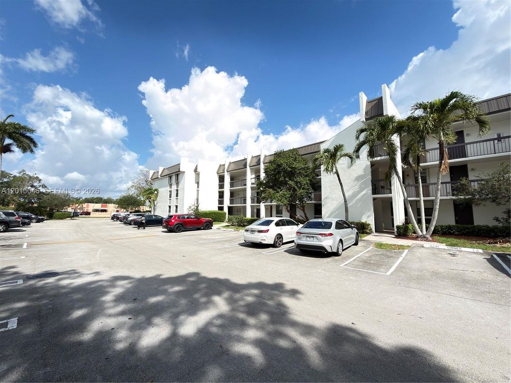Photo of 8441 Forest Hills Dr #202, Coral Springs, FL 33065 (MLS # A12015046)