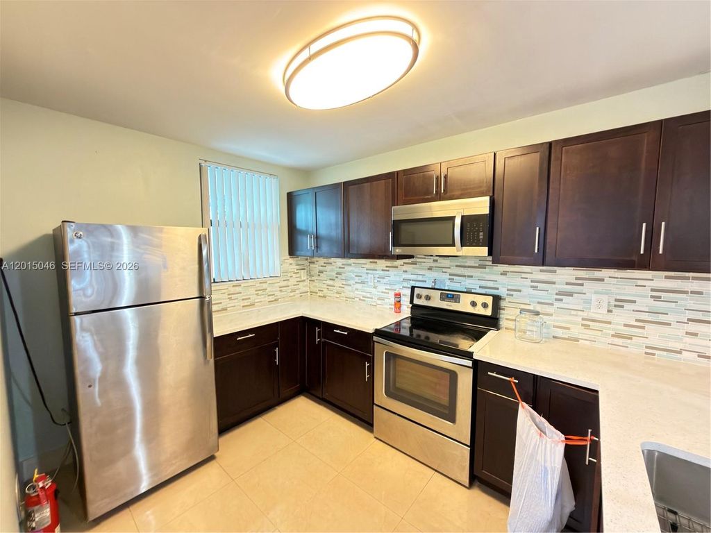 Photo of 8441 Forest Hills Dr #202, Coral Springs, FL 33065 (MLS # A12015046)