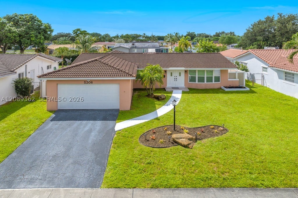 Photo of 5206 Garfield St, Hollywood, FL 33021 (MLS # A12089362)