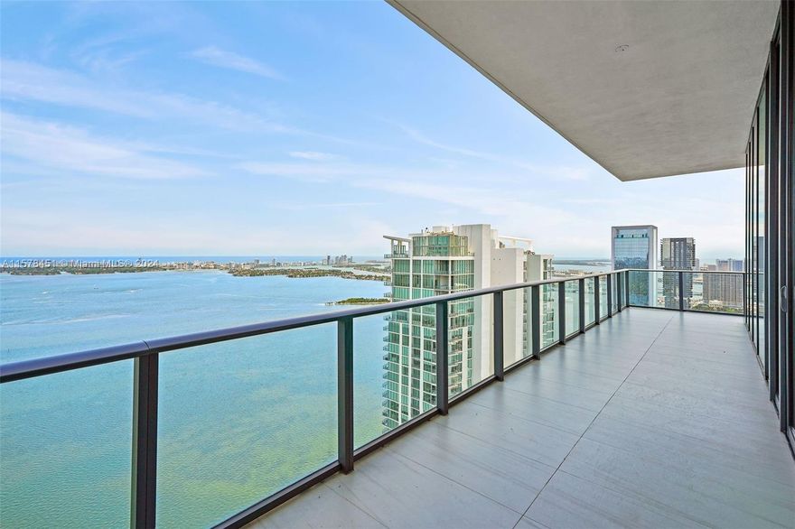 Step into this 52nd floor penthouse at Gran Paraiso with 14-foot ceilings. A private elevator takes you to this flow-through residence which feels like a private home in the sky with unobstructed views towards Biscayne Bay, Miami Beach, the Atlantic Ocean, & the Miami skyline and sunset.  This home has an upgraded modern kitchen w/ extra pantry space, upgraded bathrooms, electric curtains/shades in all rooms, custom built closets, custom lighting throughout & hot-tub on balcony & more. En-suite bathrooms in all bedrooms. Private elevator/foyer. Gran Paraiso amenities: Zero-entry pool with cabanas, lighted tennis courts, full-service spa w/ attendant, massage rooms, large fitness center, business center, yoga room, private cinema & more. 24-hr security, concierge & valet. Storage included.