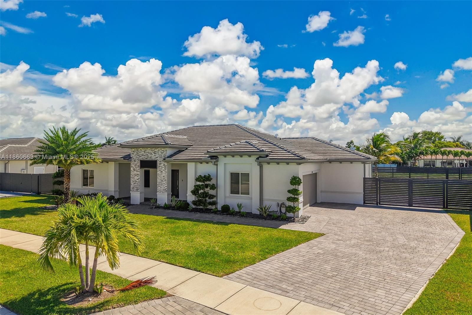 Stunning 4BR/4BA home with side-entry 2-car garage in a sought-after new construction neighborhood. Built in 2022, this spacious residence sits on an oversized 12,500+ SF lot, surrounded by homes in the million-dollar range. Features include upgraded large-format porcelain tile floors throughout, a dedicated office/flex space perfect as a kids’ playroom or your next business hub, and beautifully landscaped grounds. Fully fenced with a canal backdrop and access to walking/biking paths, all at just under $1M—an incredible opportunity for a move-in ready home in a prime location.