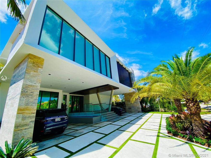 *UNIQUE*Keystone Island Contemporary Masterpiece of Architecture and Design is perfectly situated in a gated community , 24 hrs security | 5 min to high-end restaurants and Bal Harbour Shops |  78 ft waterfront and deep water dock-age |30k pounds boat lift  just 3 min to bay |6bed/5bath | 8692 total sf | pool,spa,waterfall and fountain  | 4 car garage | 24' high ceilings | 1st floor, 2nd floor and roof solid slab concrete | natural gas | Impact and solar advantages protection windows and doors | natural walnuts  Italian doors | Italian Kitchen w/ top Wolf and Sub-Zero appliances | Glass interior patio | 1600 sf outdoor living space with summer kitchen.