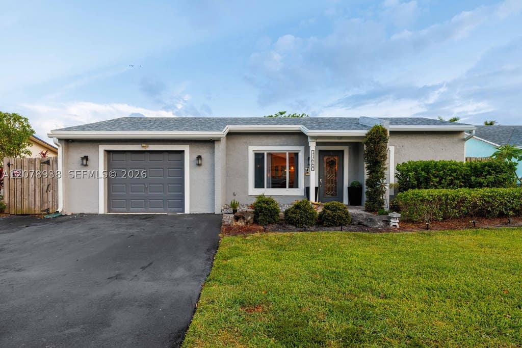 Photo of 11660 NW 38th Pl, Sunrise, FL 33323 (MLS # A12078938)