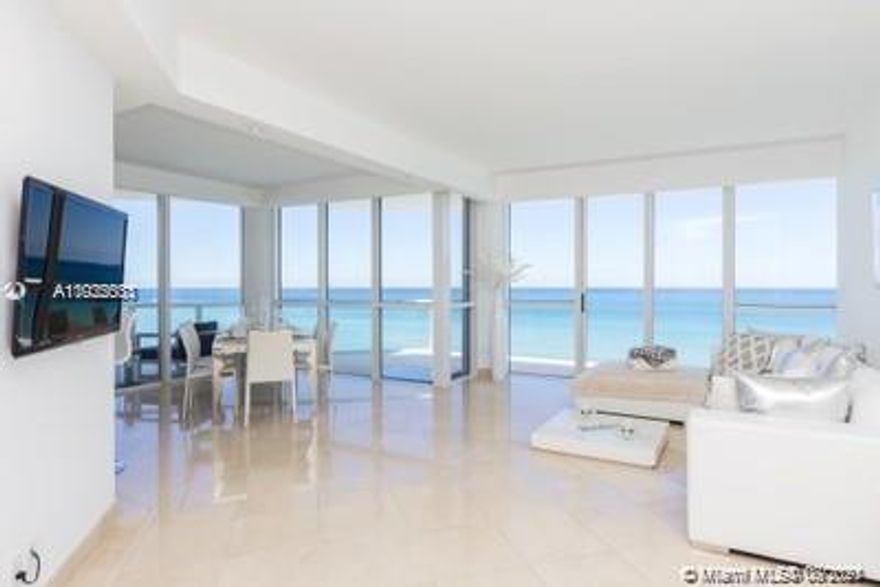 Fabulous Penthouse on Sunny Isles Beach, with wrap-around Balcony, Direct Ocean and City Views. 3 Bedrms, 2 Full Baths and 1 half-bath. Walk-in closets, Jacuzzi Tub and separate shower, double sinks in Master Bath. Floor to ceiling windows and glass sliding doors. Open Kitchen. Marble Floor thruout. Immaculate apartment, spacious, Elegantly Furnished. Storage Bin, 1 parking space+ valet parking. Private Beach Club with 2 Restaurants, Spa, Daily exercise classes, Gym, Beauty Salon, Squash Ct., Basketball Ct, Raquetball and Tennis Cts. Full Beach Service. Boat Docks available. Walk to Restaurants, shopping, A-1 school.Located between Bay Harbour shops and Aventura Mall.
