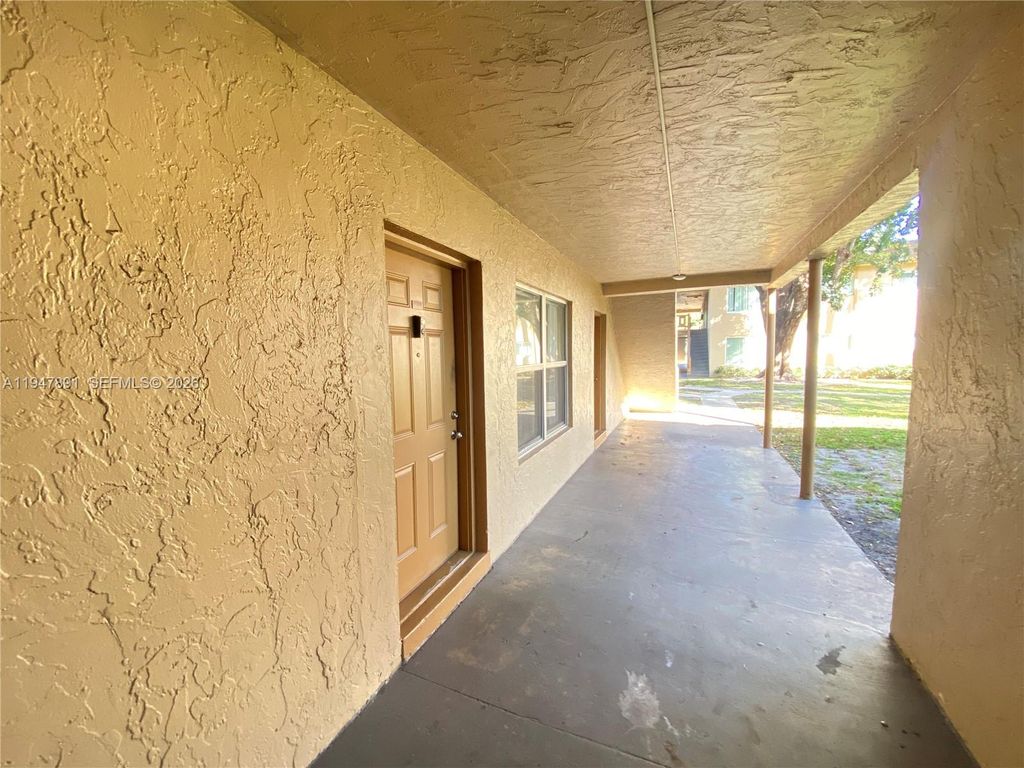 Photo of 2412 NW 39th Way #101, Lauderdale Lakes, FL 33311 (MLS # A11947891)