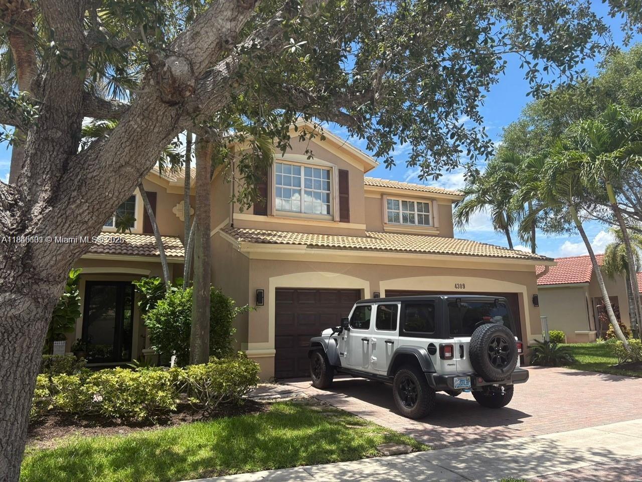 Located in the desirable Isles at Weston, this beautiful 5-bedroom, 4-bathroom home offers comfort, space, and style. The bright kitchen features granite countertops, stainless steel appliances, and ample storage. The first floor includes a guest bedroom and full bath, ideal for visitors or a home office. Enjoy a serene, fenced backyard with a travertine patio and hot saltwater spa. California closets, solar water heater, finished garage with storage, and extra closet under the stairs. Resort-style amenities include a clubhouse, 2 pools, gym, beach volleyball, basketball courts, and playground. HOA includes internet and cable. Close to A-rated schools (Manatee Bay, Falcon Cove, Cypress Bay), highways, shopping, and dining—this is a true Weston gem.