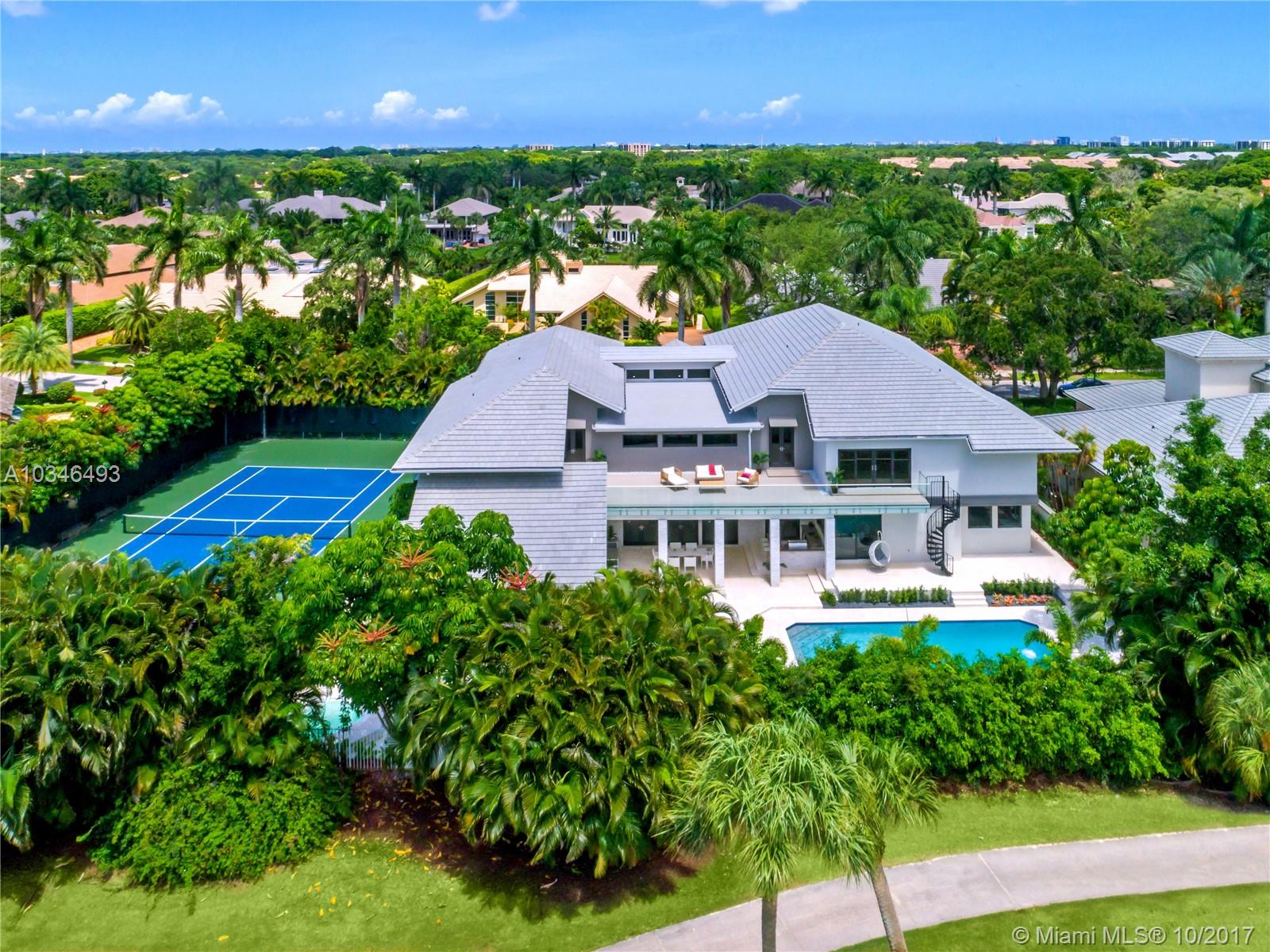 Complete rebuilt in 2017 located in Oakbrook Enclave. Boasting a whopping 14,339 sq ft. with 7 BR & Ground-floor Master with a private exit into a secluded spa area, enjoy golf/water views, private VIP guest suite, exercise room/library, & a large game room for family entertainment. 26 ft ceilings, formal dining room, bar area, creates the ultimate atmosphere for grand living & entertainment. A gourmet chefs kitchen includes the latest appliances, custom-made glass wine cellar & a large service area.
