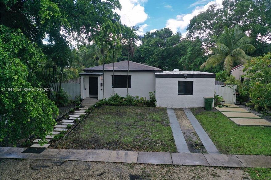 Beautifully Renovated 3 Bed / 2 Bath Home – Short Sale Opportunity – No HOA!
This stunning North Miami residence combines style, function, and comfort. Step inside to a thoughtfully updated interior featuring a sleek modern kitchen with custom cabinetry, quartz countertops, stainless steel appliances, gold hardware, and pendant lighting. The open layout flows into a cozy dining area with wood accent paneling and a stylish pendant lamp, perfect for entertaining.

The spacious living room boasts contemporary finishes, natural light, and a clean aesthetic with a neutral palette. Both bathrooms have been tastefully remodeled with elegant tile work, modern vanities, and high-end fixtures. All three bedrooms are generously sized with updated lighting, custom wall features, and ample closet space.

The property sits on a large lot with a fenced backyard surrounded by tropical landscaping — perfect for outdoor living, gardening, or future expansion. The front yard features modern pavers and lush greenery, enhancing curb appeal. Driveway parking included.

Location perks: Minutes from Gratigny Elementary, Thomas Jefferson Middle, and North Miami Senior High. Close to Gratigny Plateau Park, MOCA, Publix, Winn-Dixie, restaurants, and 125th Street’s cultural and commercial center. Quick access to I-95, 826, Turnpike, and public transit (Routes 2, 9, 10 + Golden Glades Park-and-Ride).

No HOA. Vacant and ready to move in. Don’t miss this opportunity!