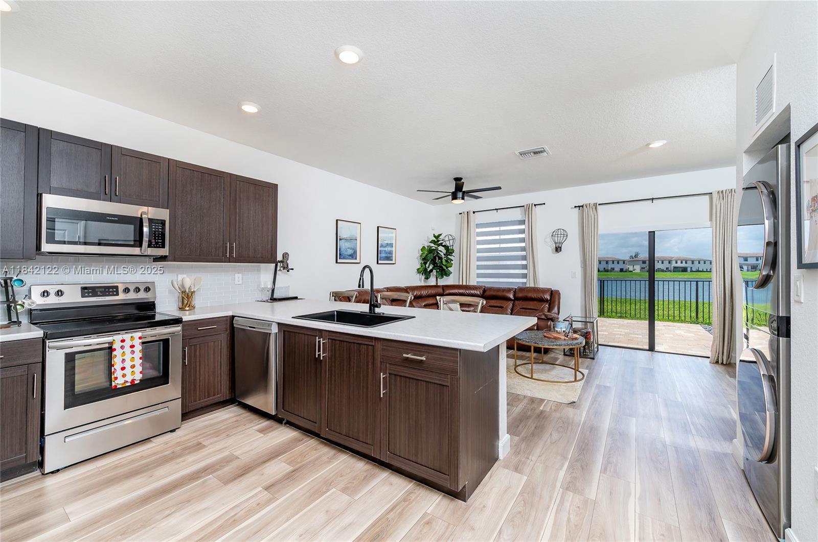 Discover this Move-in ready rare gem in the sought-after city of Cutler Bay – the only Waverly Collection townhome on the lake currently available! Built in 2021, this 3-bedroom, 2.5-bath beauty offers modern living with vinyl flooring throughout (no carpet), stainless steel appliances, and chic zebra blinds. Enjoy two spacious living areas for dining and entertaining, with all bedrooms conveniently located upstairs. Step outside to a serene lakefront view where you can watch stunning sunrises and sunsets. Need financing? Our trusted loan officer offers multiple options to make this dream home yours!