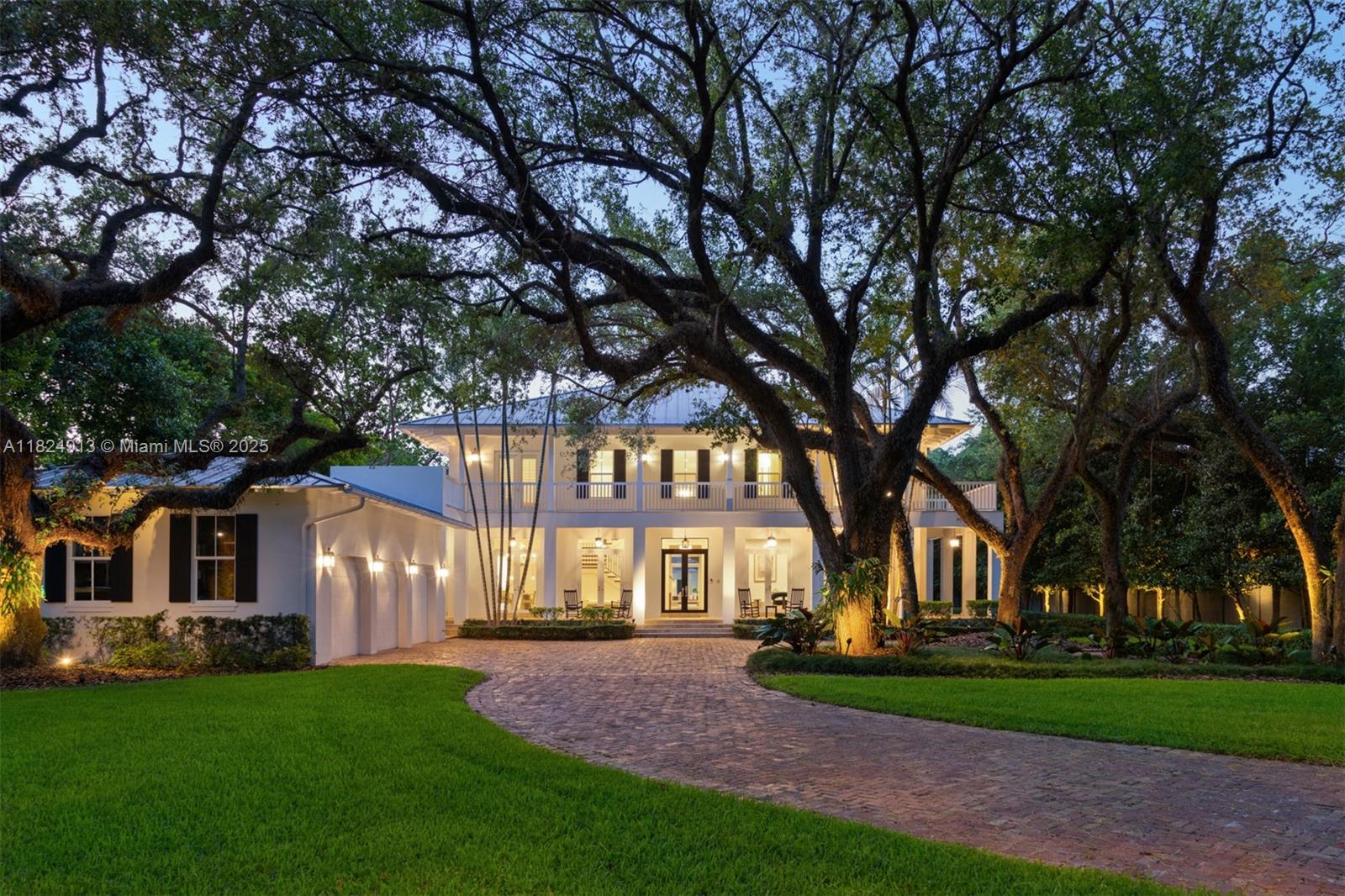 Beautiful Charleston charm home nestled in the exclusive gated community of Stonegate, in the prestigious Ponce/Davis area. This elegant estate spans a lush acre beneath majestic mature oaks. Designed with high ceilings, detailed millwork, and expansive living areas, it offers 5 beds, 5.5 baths + a detached 1BD/1BA guest house, and a grand primary suite. Wraparound porches overlook a resort-style pool and manicured gardens, 3 car garage & ample motor court. Stonegate provides 24/7 security, lighted tennis courts, and a playground—close to elite private & public schools.