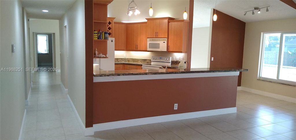 Photo of 15013 SW 10th St, Sunrise, FL 33326 (MLS # A11988251)