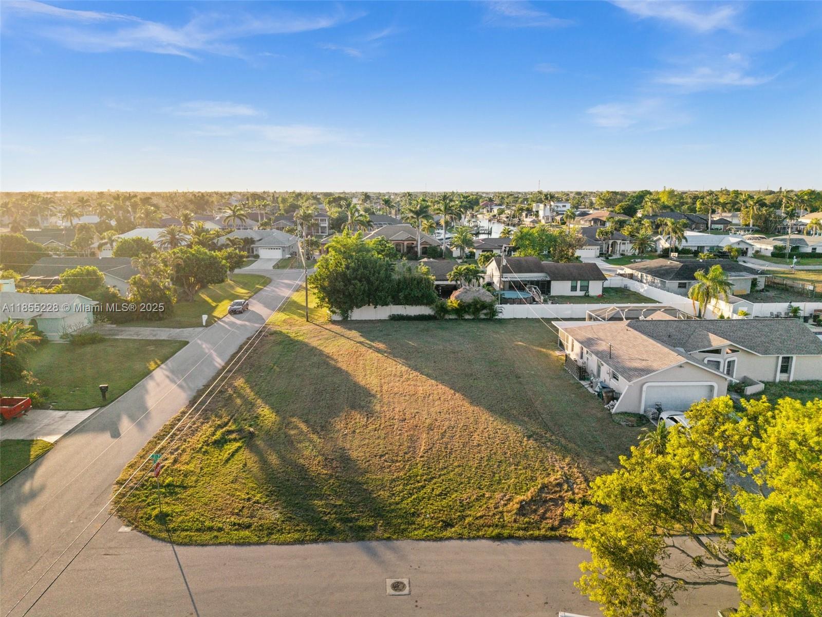Location, Location, Location, no need to look any further! Are you ready to build your dream home? Bring your Builder!! Beautiful Corner LOT on a quiet road in a desired neighborhood in SE Cape Coral! Close to shopping, restaurants, and bridges to downtown Fort Myers. Make this beautiful lot your piece of paradise. Don't wait, this won't be available for long! City Water and Sewer! All Assessments are paid!