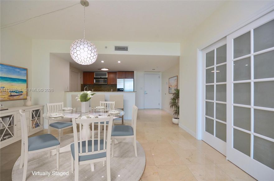 Beautiful 1,350 SF 2Bed/2Bath corner unit with TWO Assigned Parking Spaces PLUS an additional bedroom-sized DEN perfect as an office, study, home gym, game, or music room. The exceptional Dadeland location offers quick and easy access to US1, 826, 878, Pinecrest, South Miami, Baptist Hospital, and Dadeland Station shopping mall. Publix, Dadeland Mall, Dadeland South Metrorail Station, fine dining, shopping, and entertainment are all just steps away. The bright and open layout with polished marble floors features large bedrooms with walk-in closets, spacious bathrooms, new central air conditioning system, modern kitchen with SS appliances and granite countertops, in-unit washer and dryer, large high-impact windows with expansive city views, and large private balcony to enjoy the sunsets and Florida’s beautiful weather.  The Metropolis offers luxurious, full service 24/7 concierge, 24/7 valet parking, 24/7 security patrol, state-of-the-art gym, cardio fitness center, sauna, two pools, jacuzzi, and resident lounge. Peace of mind, comfort, convenience, entertainment, safety, and security all right at home. Don’t miss this unique opportunity!