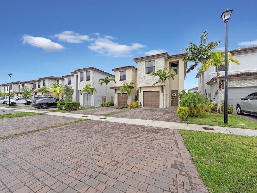 Welcome to your dream in the beautiful community of Allapattah Gardens, this stunning two-story twin home features 3 Bedrooms and 2.5 baths and a spacious one-car garage. The open-concept first floor boasts a modern kitchen, a functional island, stainless steel appliances, a dining and living area, and a convenient half-bath. Upstairs newly installed waterproof laminate flooring, discover a laundry room, a huge master bedroom, with a large walking closet. 2 bedrooms with a bath, impact windows and doors, entertaining, relaxing custom yard lighting, and fenced. Enjoy top-notch amenities, a fitness center, and a luxury large pool in the clubhouse. Pavers driveway for 4 cars and plenty of parking at the front. Minutes from Turnpike, Black Marina, Restaurants, malls and more.