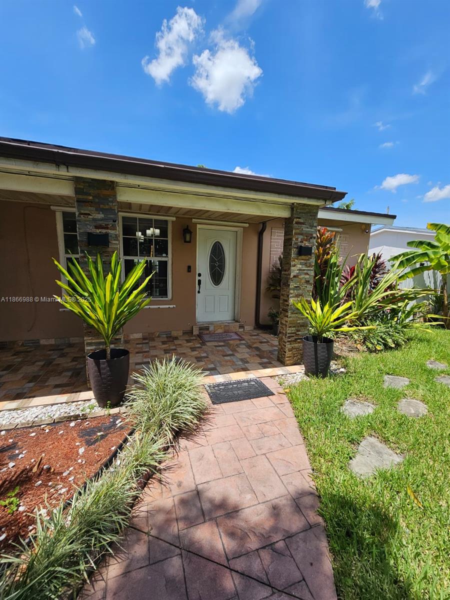 Discover this exquisite 3-bed, 2-bath single-family home, designed for seamless entertaining. The open-concept layout features a versatile den, sleek stainless steel appliances, and a full-size washer/dryer. Unwind on the stunning terrace with a built-in sink and BBQ, perfect for gatherings. A storage shed provides ample space, while lush fruit trees, including avocado and mango, infuse tropical charm. Nestled in a sought-after neighborhood, this home blends comfort and elegance effortlessly.