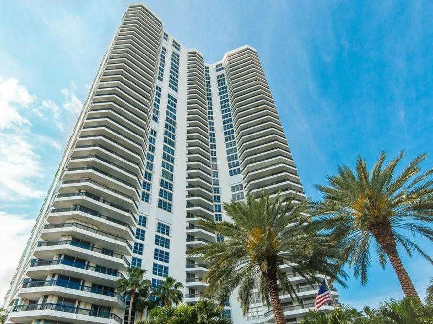 BREATHTAKING VIEWS FROM THIS NORTHEAST CORNER UNIT. HARD WOOD FOORS IN LIVING ROOM, CONTEMPORARY  FURNITURE, UPDATED KITCHEN AND BATHROOMS. BUILDING HAS GREAT AMENITIES INCLUDING TENNIS COURTS. MARINA DOCKS AVAILABLE.