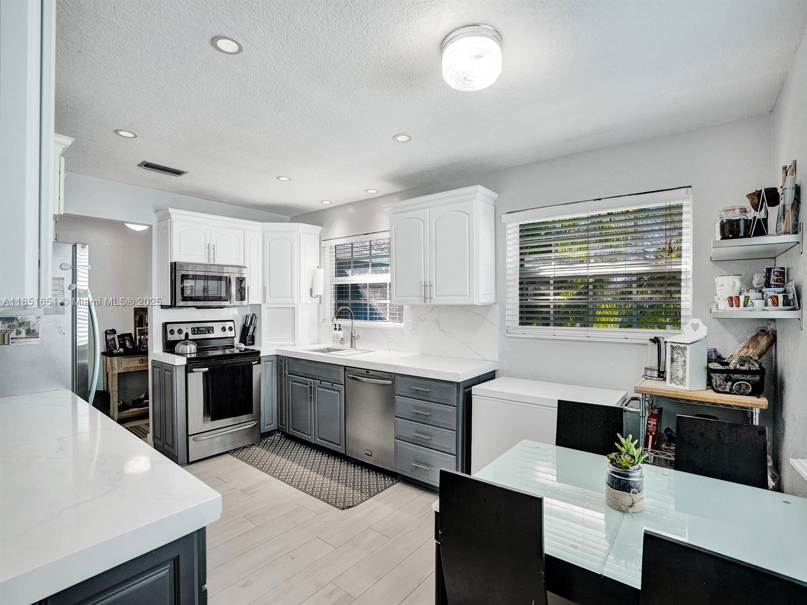 Stunning and sun-filled 4 bedroom and 3 bath home in Dania Beach East of US1 (Federal Highway), ideally located just minutes from the airport, beaches, Fort Lauderdale, Hollywood, and Aventura. This elevated home boasts no flood concerns and showcases modern upgrades throughout, including updated electrical, a spacious master suite and dedicated office, and a full laundry room. Enjoy serene outdoor living with a beautifully designed courtyard for enhanced privacy and outdoor space. The open layout offers both comfort and tasteful style, making it ideal for families and people who work from home. This is a true 4-bedroom, 3-bath home, impeccably maintained and move-in ready. Easy to show! Lease-purchase option will also be considered. Price reflects annual rental. 1/2 year also available.