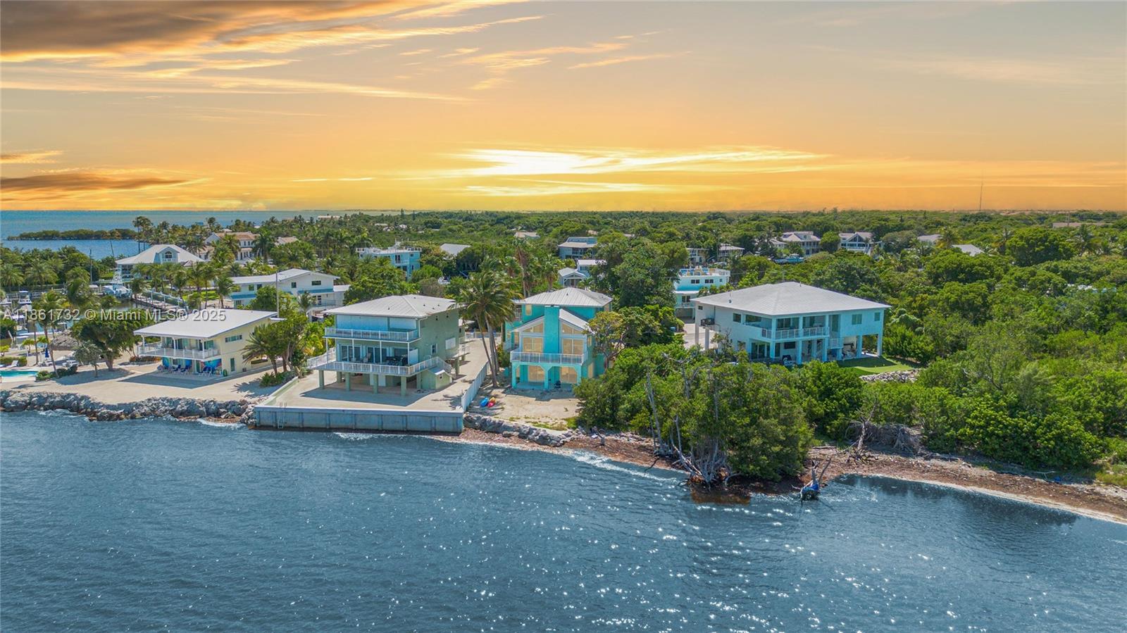 Simply the best location, exclusive & extremely private. It's tucked away in the prestigious "Plantation Lake Estates," a highly sought-after gated community with an on-site boat ramp and park. This Coastal-Styled Beach Home is in a prime location at Mile Marker 87, across the street from Founders Park, which has a beach, tennis courts, a full-service marina, a dog park, sports fields, and Olympic-size lap pools. This home boasts a stunning great room with a gorgeous coral fireplace and soaring wood beam ceilings. They all overlook the glistening Atlantic Ocean, providing priceless views and sunrises. The home has a modern kitchen and updated baths, as well as impact windows and doors. There are three inviting bedrooms, including a third-floor primary en-suite with a private porch.