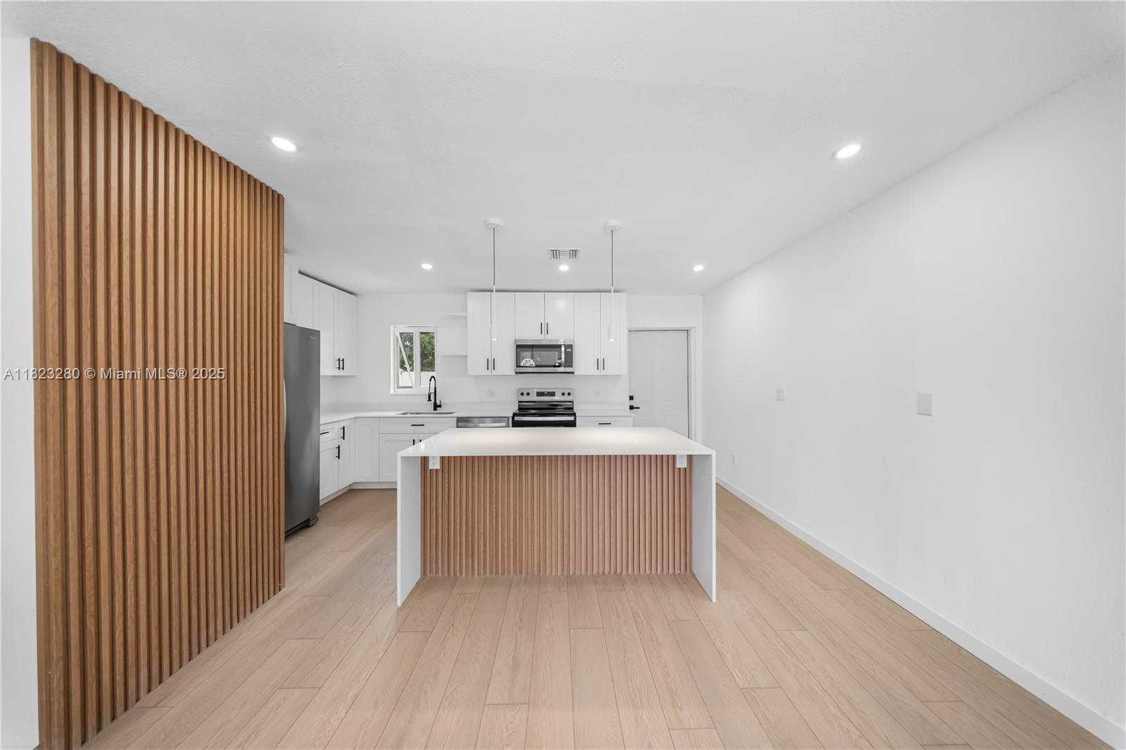 This fully remodeled property offers three beds, two baths, and a converted garage apartment. Perfect for rental income, guests, or a private office. Enjoy a spacious open-concept layout with a modern island kitchen and sleek finishes. Roof (2017) and A/C (2019). Both are in excellent condition. Newly installed impact windows, upgraded plumbing/electrical, and surveillance system. The backyard is fully fenced, perfect for kids and pets. Driveway, landscaping, front, and terrace will be completed before closing. The apartment is occupied. It will be vacant before closing. Located near great schools, St. Thomas University, major highways, Hard Rock Stadium, shopping, and parks with family-friendly recreation. Don’t miss out! Book your tour today!