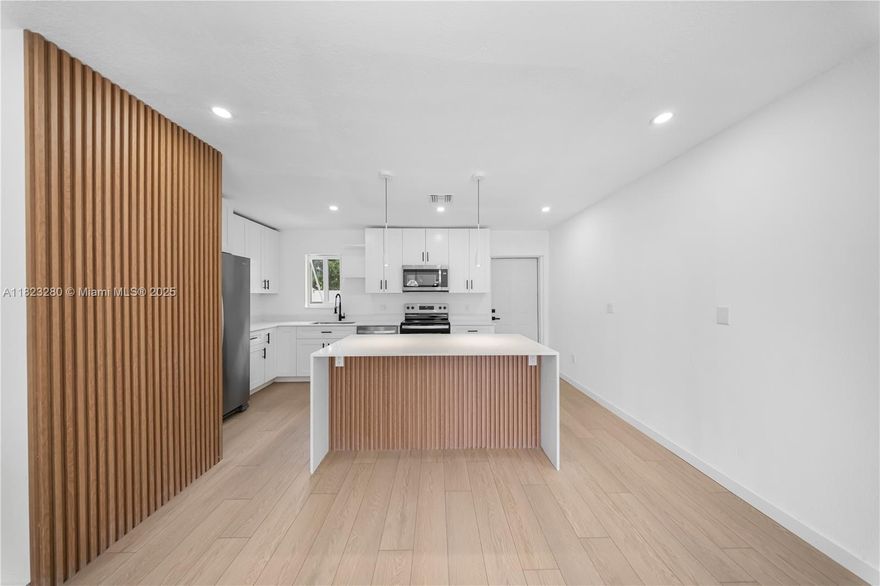 This fully remodeled property offers three beds, two baths, and a converted garage apartment. Perfect for rental income, guests, or a private office. Enjoy a spacious open-concept layout with a modern island kitchen and sleek finishes. Roof (2017) and A/C (2019). Both are in excellent condition. Newly installed impact windows, upgraded plumbing/electrical, and surveillance system. The backyard is fully fenced, perfect for kids and pets. Driveway, landscaping, front, and terrace will be completed before closing. The apartment is occupied. It will be vacant before closing. Located near great schools, St. Thomas University, major highways, Hard Rock Stadium, shopping, and parks with family-friendly recreation. Don’t miss out! Book your tour today!